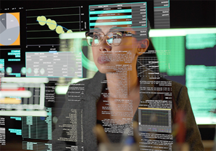 employee looking at clear screen with information on it