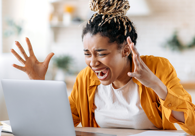 employee freaking out at laptop