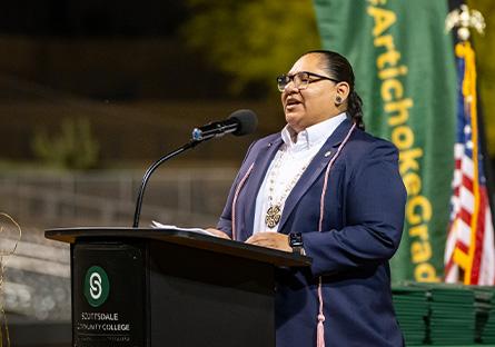 Mikah Carlos speaking at Scottsdale Community College's 2024 Commencement ceremony