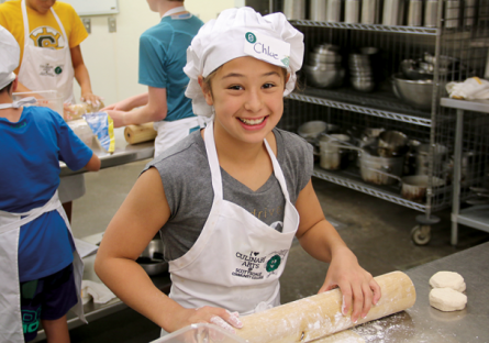 A photo of kids learning about cooking at SCC's culinary program.