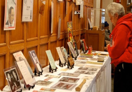 Woman looking at Black History 1010 Mobile Museum artifacts