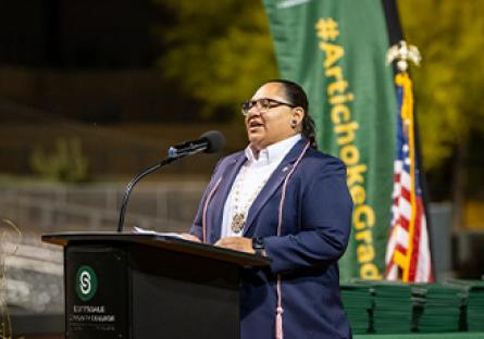 Mikah Carlos speaking at Scottsdale Community College's 2024 Commencement ceremony