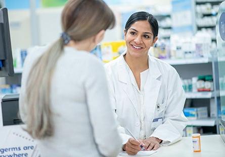 pharmacy technician assisting customer