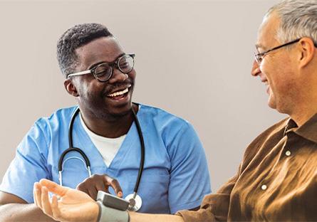 nurse assisting elderly person